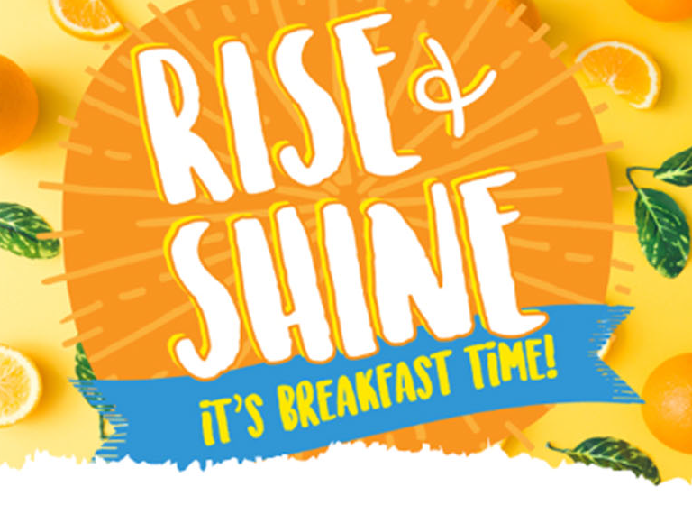Graphic of a sun with the text Rise & Shine, It's Breakfast Time!